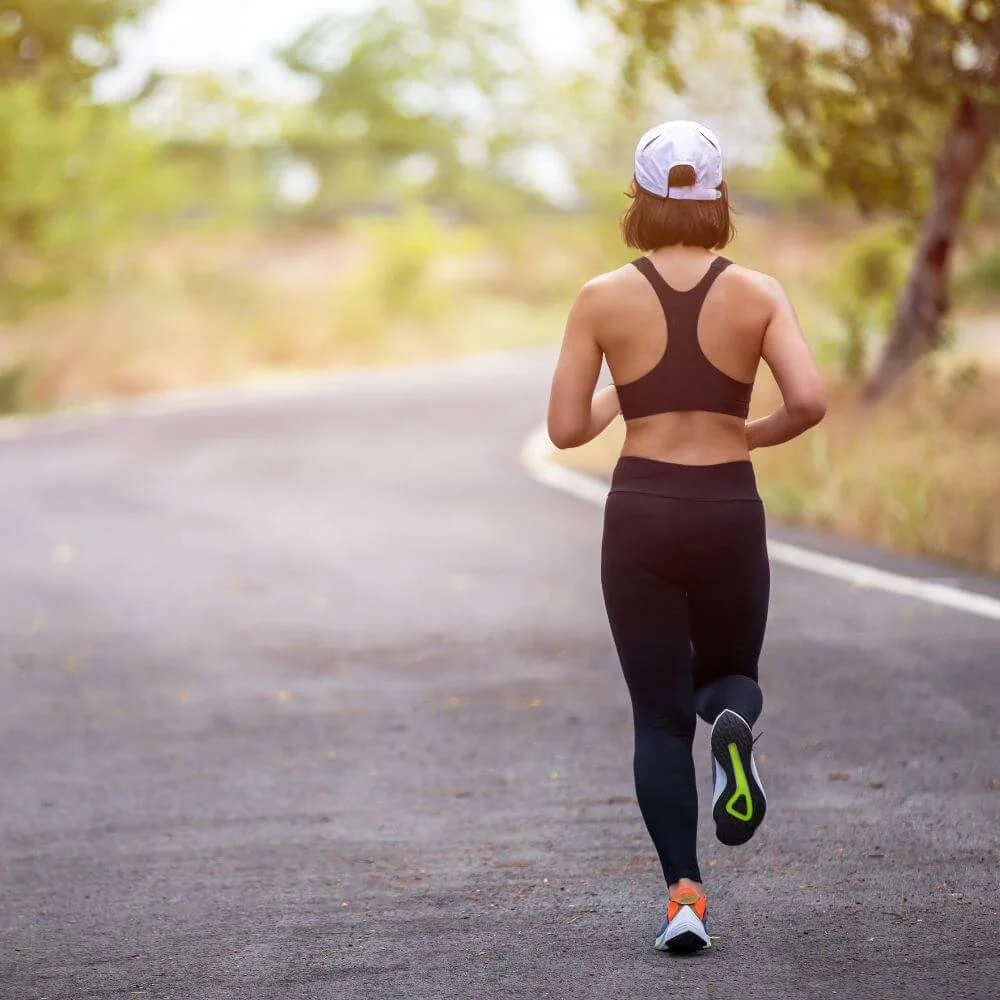 Active woman running, an activity that tests pelvic floor coordination