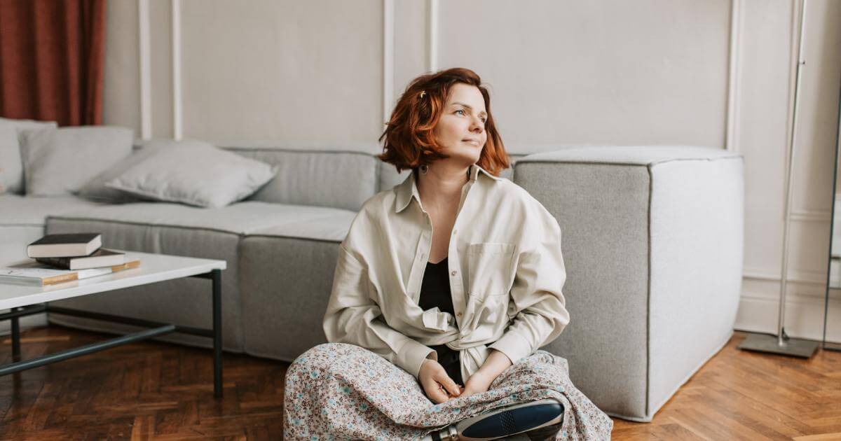 Woman sitting in a calm, grounded pose, symbolizing a realistic approach to pelvic floor dysfunction in women over 35.