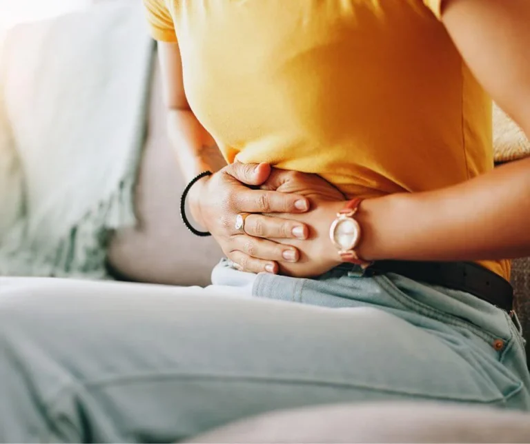 Woman experiencing hormonal digestive changes and bloating after 40